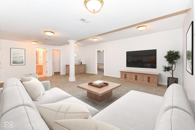 living room featuring light colored carpet and decorative columns