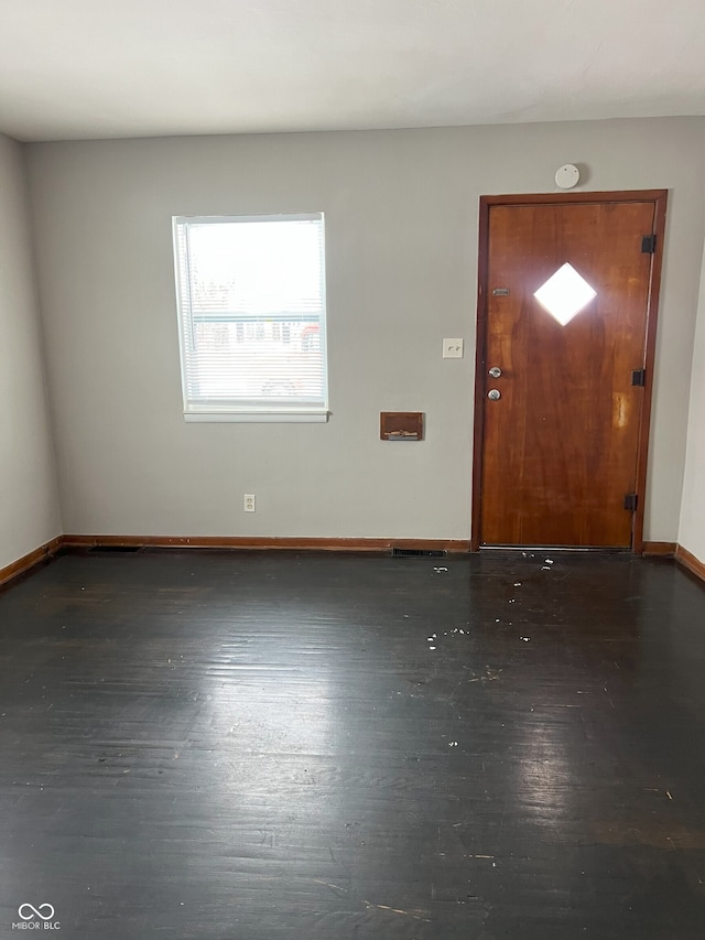 foyer entrance featuring dark hardwood / wood-style floors