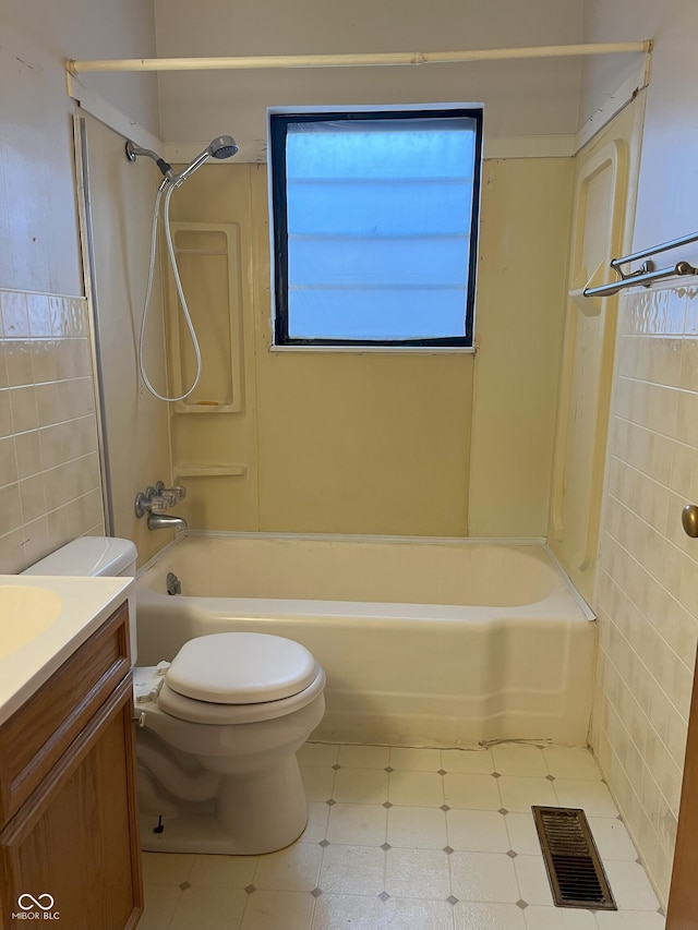 full bathroom featuring toilet, vanity, and shower / bathing tub combination