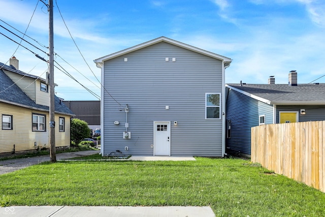 1446 E Naomi St, Indianapolis, IN 46203 - rear view of property featuring a lawn and fence