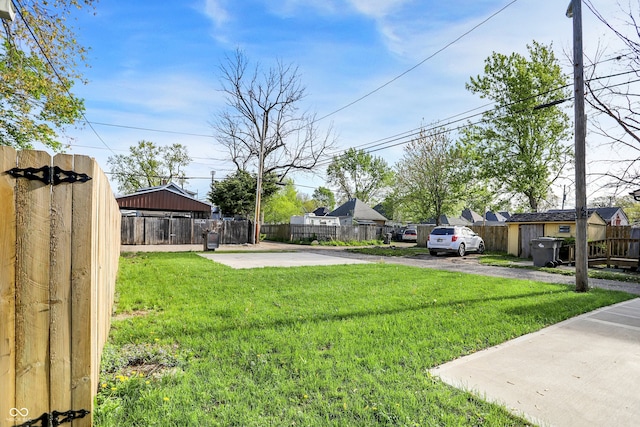 1446 E Naomi St, Indianapolis, IN 46203 - view of yard featuring fence, driveway, and a residential view