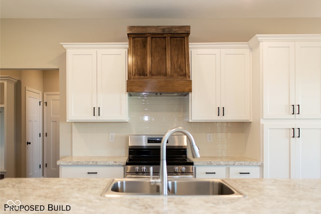 kitchen with white cabinetry and tasteful backsplash