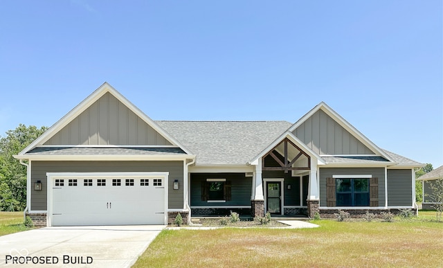 craftsman house featuring a garage and a front lawn