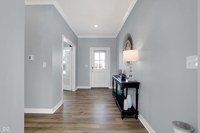 entrance foyer featuring dark hardwood / wood-style flooring and ornamental molding