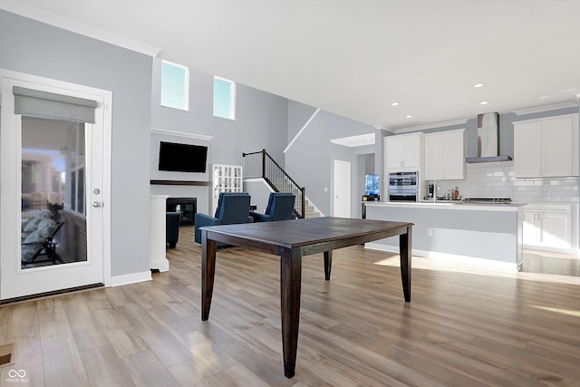 playroom with light wood-type flooring and sink