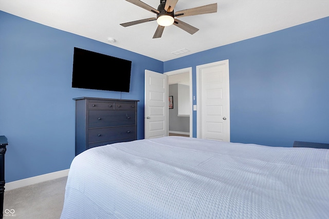 bedroom featuring light carpet and ceiling fan