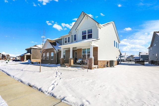 view of front of home with central AC unit and a porch