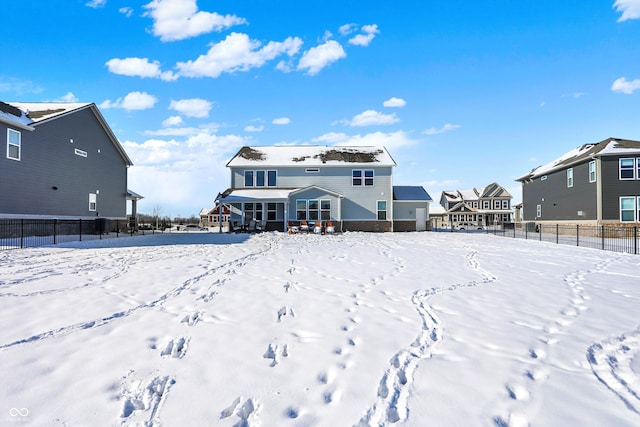 view of snow covered house