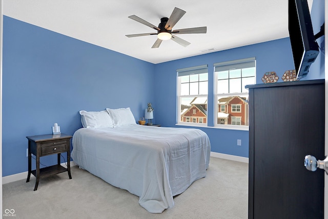 bedroom featuring ceiling fan and light colored carpet