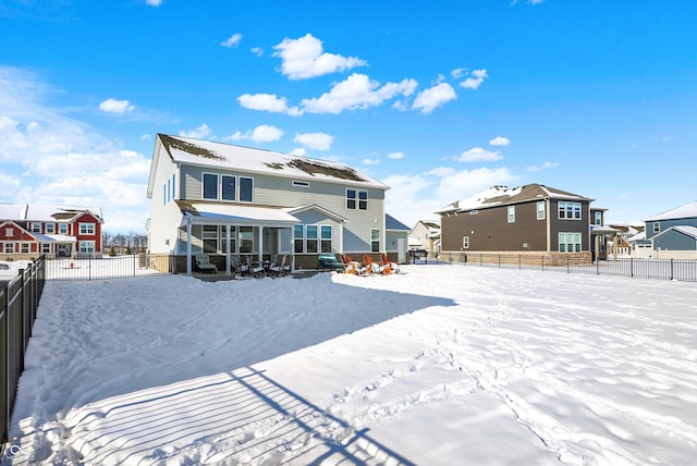 view of snow covered house