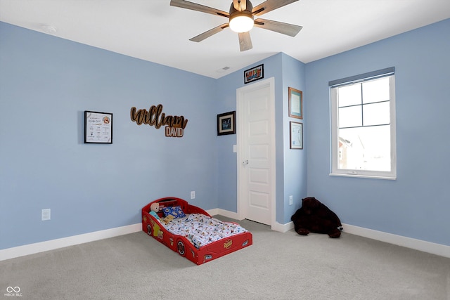 carpeted bedroom with ceiling fan