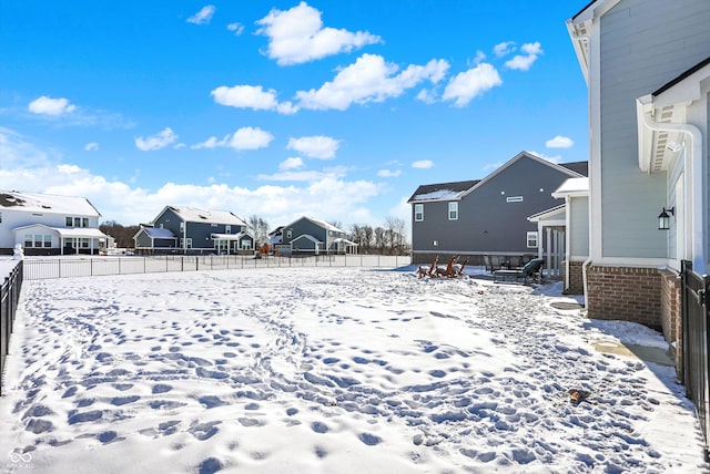 view of yard covered in snow