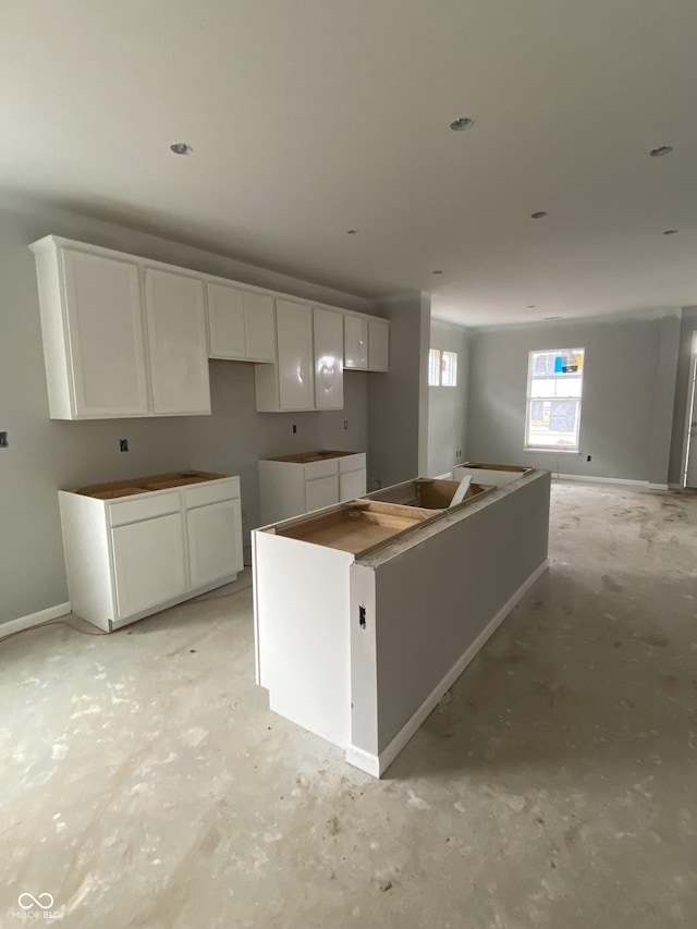 kitchen featuring white cabinets and a kitchen island