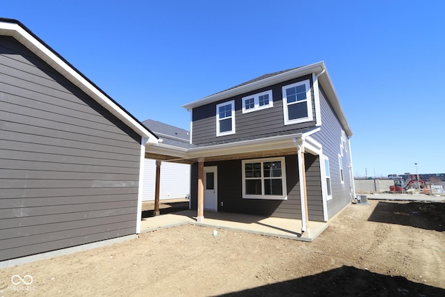 back of property featuring a patio area