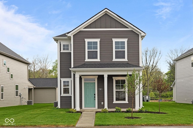 1713 Real St, Indianapolis, IN 46240 - view of front of home featuring a front yard, central AC, covered porch, and board and batten siding