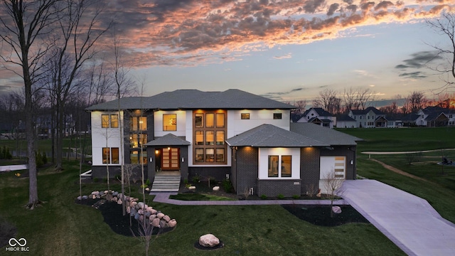 prairie-style home featuring a yard