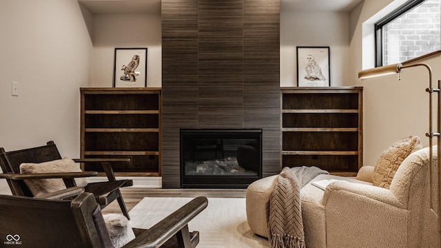 living room featuring a large fireplace