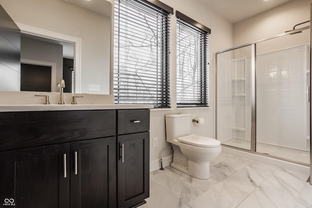 bathroom featuring toilet, plenty of natural light, and an enclosed shower