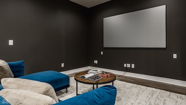 cinema room featuring wood-type flooring