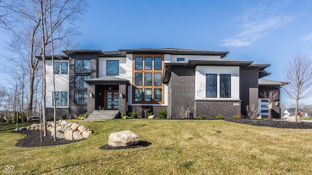 prairie-style house with french doors, brick siding, and a front yard