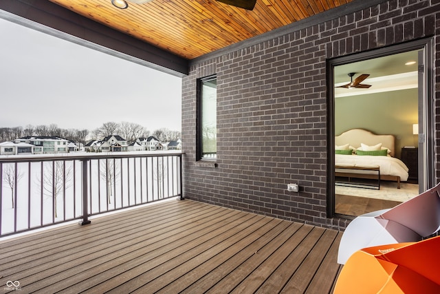 wooden deck with ceiling fan