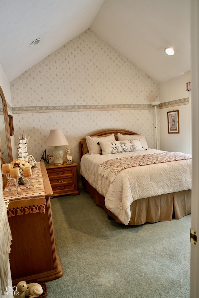 carpeted bedroom featuring lofted ceiling