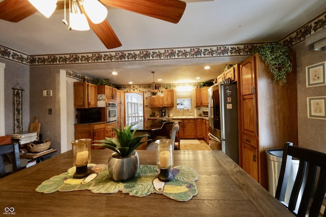 dining room featuring sink and ceiling fan