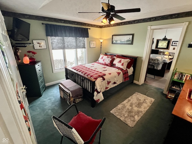 carpeted bedroom featuring a textured ceiling and ceiling fan