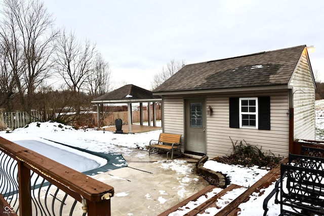 exterior space featuring a gazebo and an outdoor structure