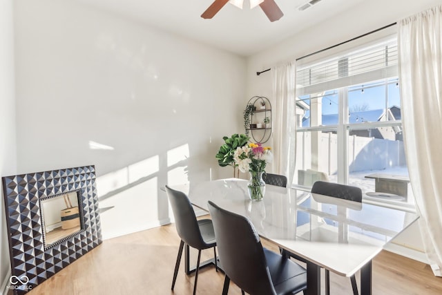 dining area featuring ceiling fan and light hardwood / wood-style flooring