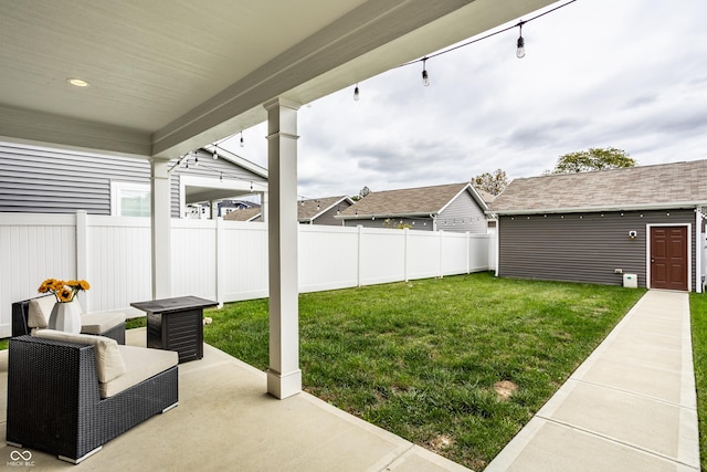 view of yard with a patio area and an outdoor structure