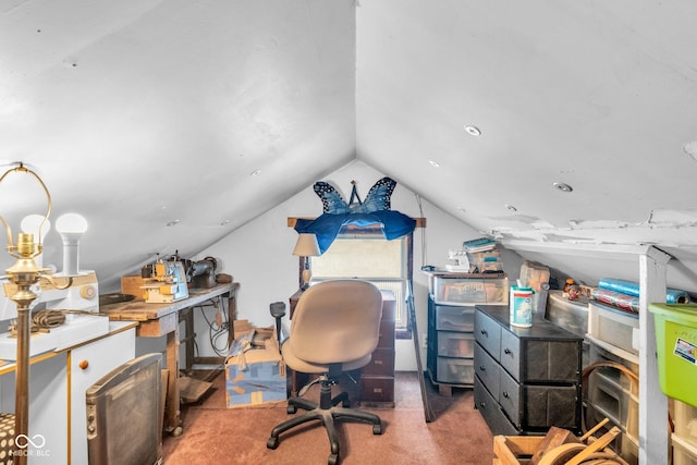 home office with lofted ceiling and carpet flooring