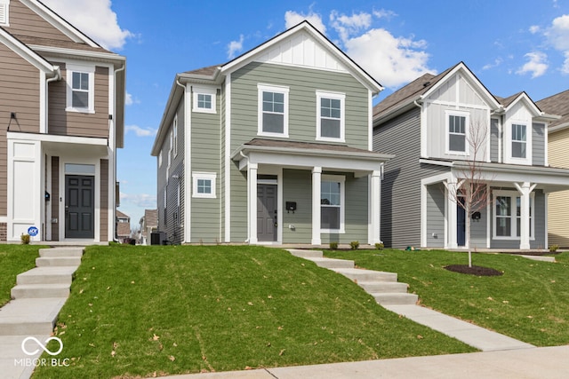 view of front of home with a front yard and central air condition unit