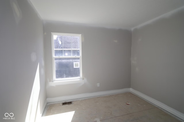 unfurnished room featuring visible vents and baseboards