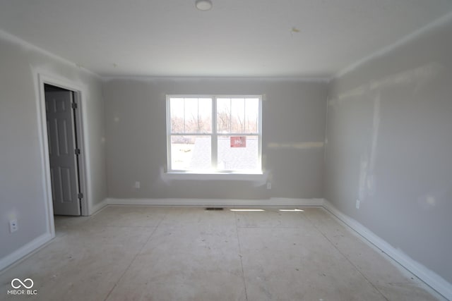 empty room featuring baseboards