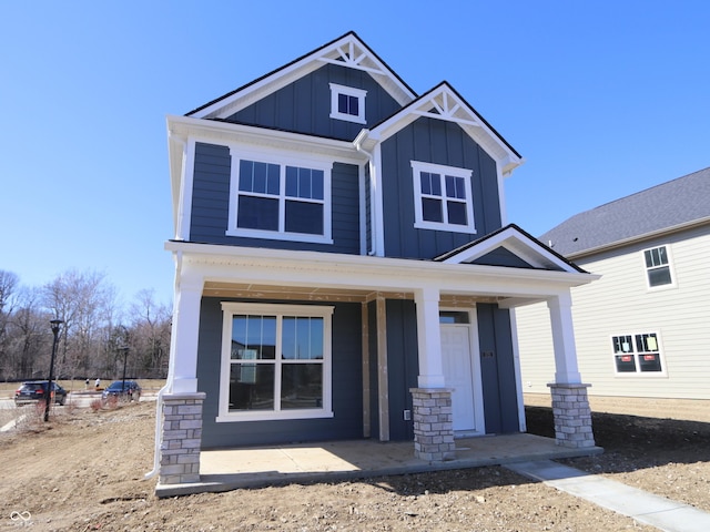 craftsman inspired home featuring a porch and board and batten siding