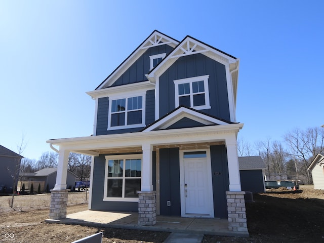 craftsman inspired home featuring a porch and board and batten siding