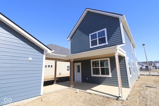 back of property with a patio area