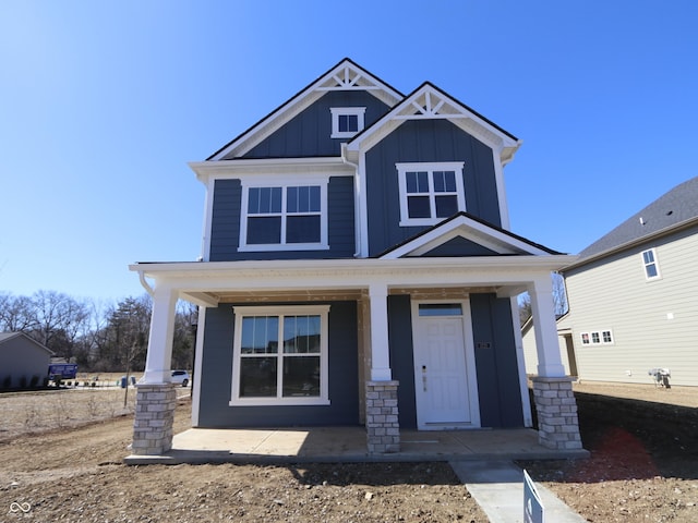 craftsman house with a porch and board and batten siding