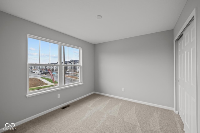 1721 Real St, Indianapolis, IN 46240 - unfurnished bedroom with a closet, baseboards, and carpet floors