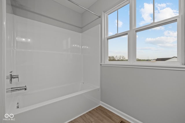 1721 Real St, Indianapolis, IN 46240 - full bath with baseboards, wood finished floors, and tub / shower combination