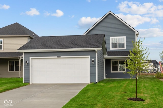 1721 Real St, Indianapolis, IN 46240 - traditional home featuring an attached garage, concrete driveway, a front lawn, and a shingled roof