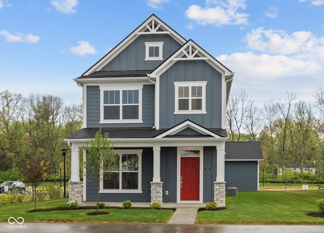 1721 Real St, Indianapolis, IN 46240 - craftsman house with board and batten siding, a front lawn, a porch, and a shingled roof