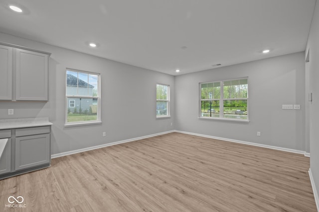 1721 Real St, Indianapolis, IN 46240 - unfurnished living room with light wood-style flooring, healthy amount of natural light, recessed lighting, and baseboards