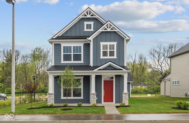 1721 Real St, Indianapolis, IN 46240 - craftsman-style home with board and batten siding, a front yard, stone siding, a porch, and a shingled roof