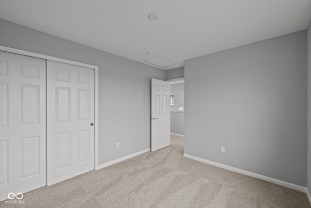 1721 Real St, Indianapolis, IN 46240 - unfurnished bedroom featuring attic access, carpet flooring, baseboards, and a closet