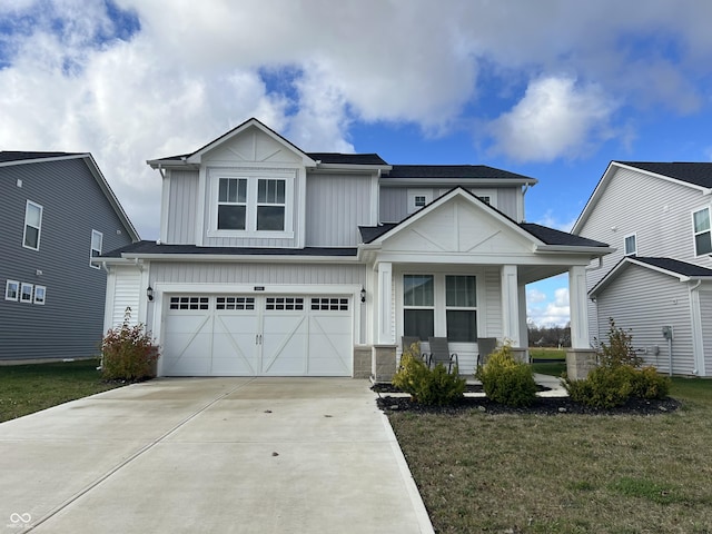 craftsman-style home with a porch, a front lawn, and a garage