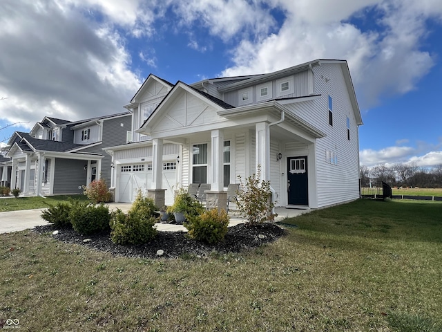 craftsman-style home with a garage, a porch, and a front lawn