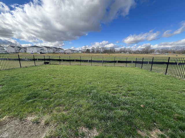 view of yard with a rural view