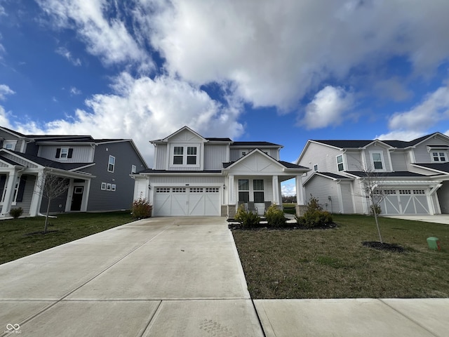 view of front of home with a front yard and a garage